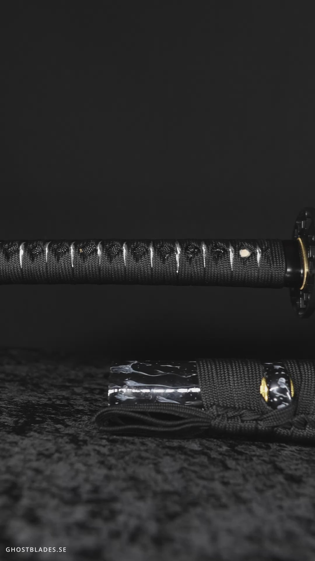 Cinematic showcase of the Santa Muerte Katana by Ghost Blades - handmade samurai sword in T10 steel with genuine hamon, black saya and skeletal silver fittings inspired by death, faith and rebirth.