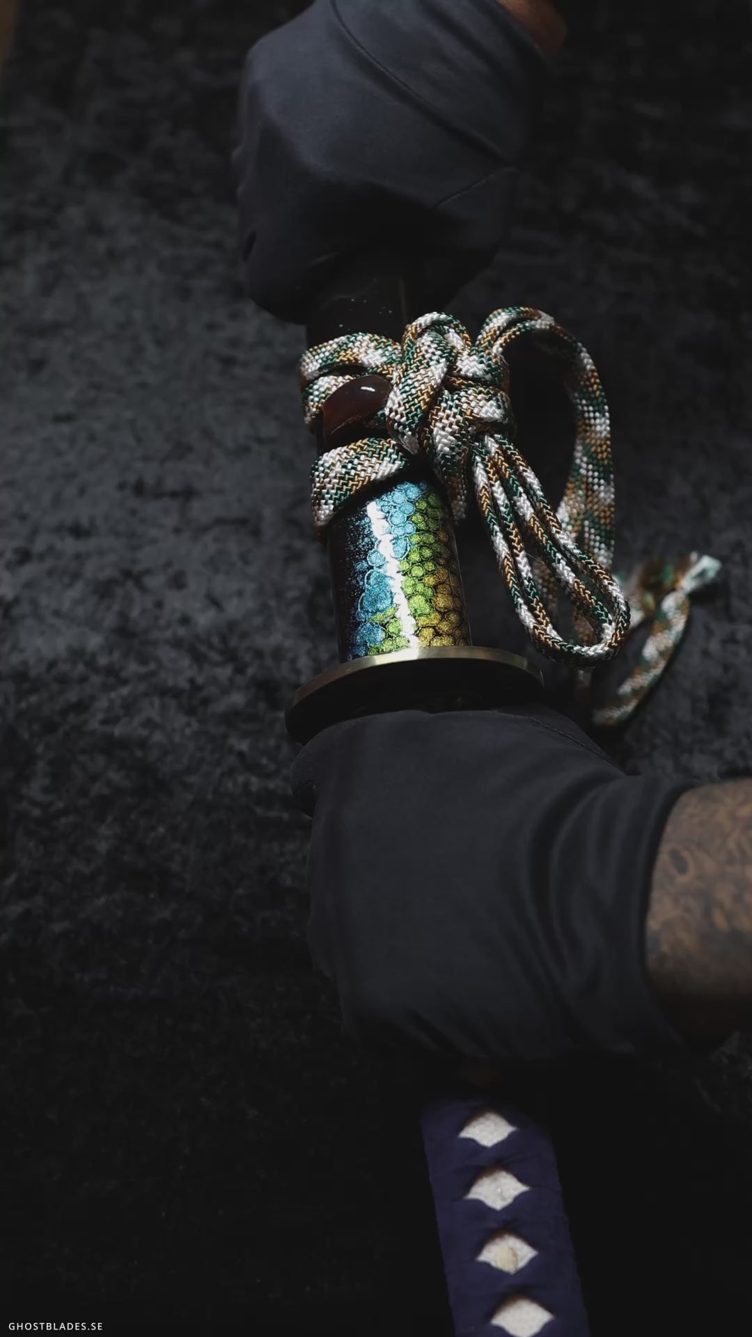 Cinematic showcase of the Reptilian Katana by Ghost Blades - handmade samurai sword in T10 steel with genuine hamon, green saya and scale-patterned fittings inspired by serpentine power and precision.